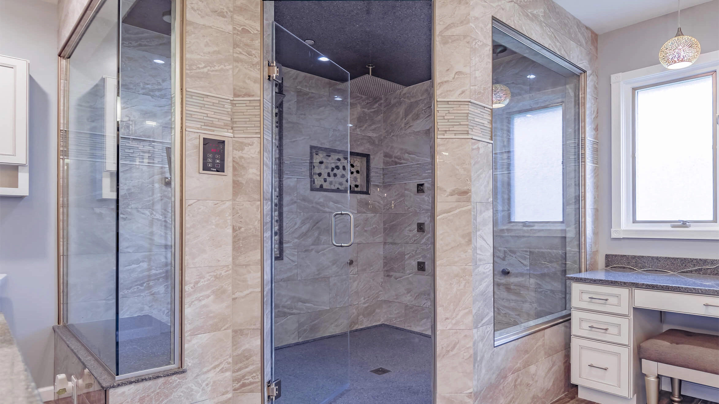 Modern onyx shower with glass doors in a luxurious bathroom.